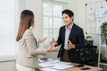Business Collaboration. Professionals discussing project details in modern office.