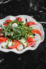 Salad with dressing and fresh vegetables