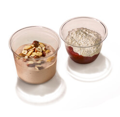 Two healthy dessert cups featuring pudding with nuts and chia seed pudding