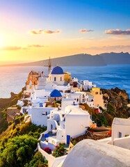 Obraz premium Sunset Over White Buildings on Oia, Santorini Island – Scenic Aegean View