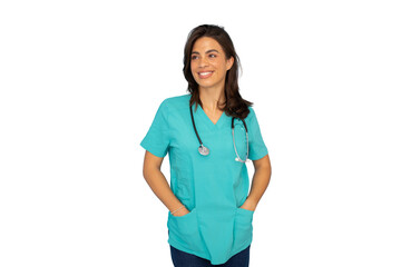 Smiling female healthcare worker wearing blue scrubs and stethoscope, standing confidently with hands in pockets, white background