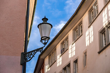 Vintage Ornate Old Street Lamp Fixture in European Alleyway, Sunny Day View Up.Classic Streetlight...