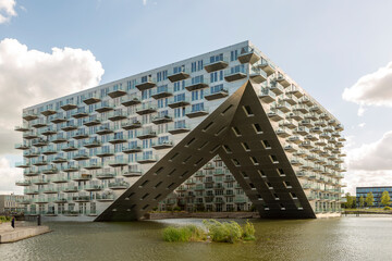 IJburg island modern floating architecture of Sluishuis in Amsterdam, The Netherlands. Contemporary Dutch design apartment complex. Housing market and real estate investment. 
