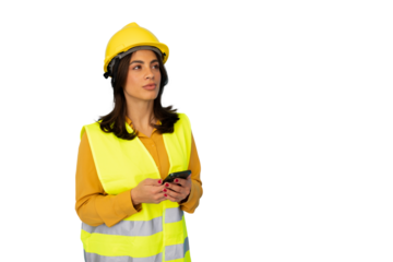 Confident female engineer wearing safety vest and helmet using smartphone on transparent background