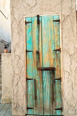 old blue door in traditional town street 