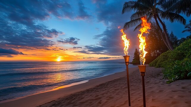 Ocean sunset with tiki torches on the beach under palm trees and a cloudy sky at dusk in a tropical location