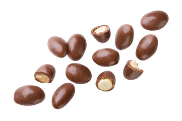 Peanuts covered in chocolate and pieces flying close-up on a white background. Isolated