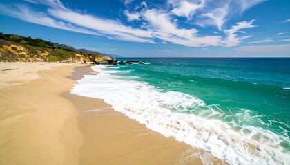 Sandy beach with ocean waves, and coast.