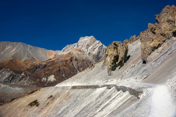 A new wide trekking route to Tilicho base camp in sunny autumn day. Annapurna circuit trekking, Himalaya mountains, Nepal.