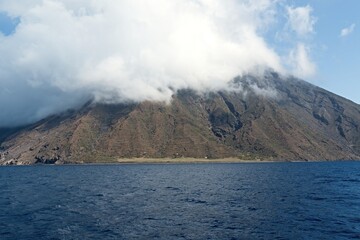 View from a boat to the Stromboli volcano on Stromboli island in the Tyrrhenian Sea. Aeolian (Lipari) Islands. Italy. Europe.