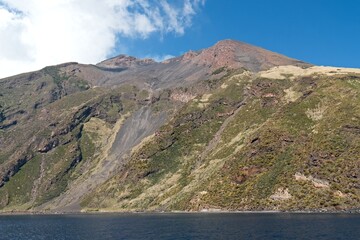 View from a boat to the Stromboli volcano on Stromboli island in the Tyrrhenian Sea. Aeolian (Lipari) Islands. Italy. Europe.