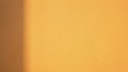 Textured Yellow Wall with Shadow Ideal for Backgrounds and Design Elements