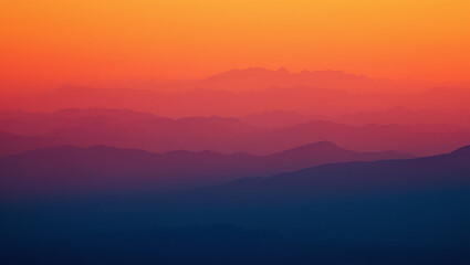 Layered Mountain Range Silhouette with Colorful Gradient Sky at Sunset or Sunrise