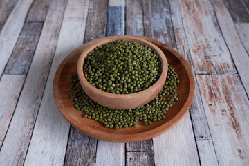 Mung bean in wooden bowl and plate.