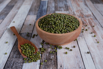 Mung bean in wooden bowl and plate.