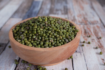 Mung bean in wooden bowl and plate.