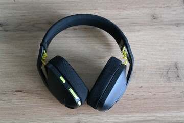 bluetooth headphones resting on desk bluetooth headphones resting on desk