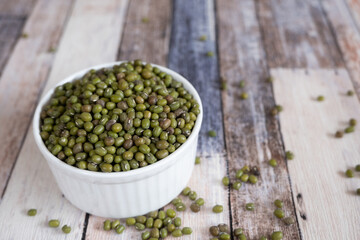 Mung beans in a white bowl.