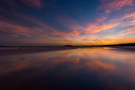 Sunset over calm ocean water
