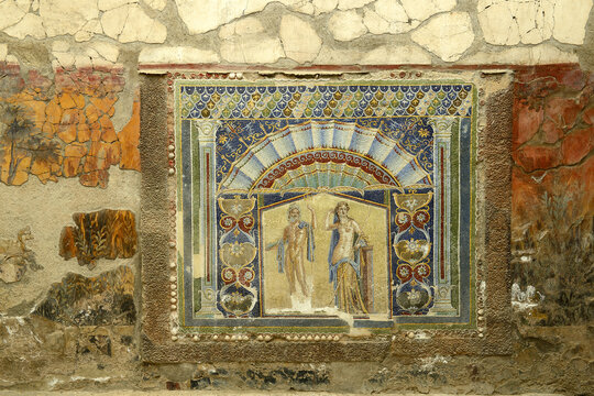A Roman mosaic on a wall in the House of Neptune and Amphitrite. Ruins of ancient roman town Ercolano - Herculaneum, destroyed by the eruption of the Mount Vesuvius in AD 79, Vesuvio volcano. Italy