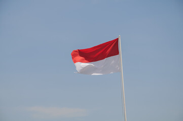 indonesian flag at blue sky background