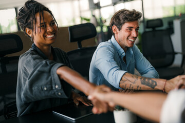 Diverse multiethnic business people, handshake for agreement, b2b deal and cooperation for project