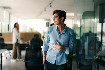 Fototapeta premium Young male startup ceo leader business man, success people standing in office.
