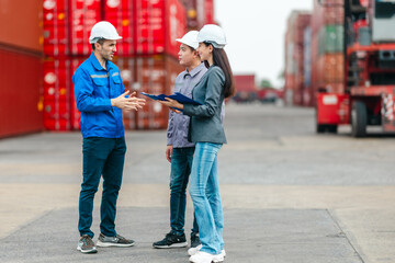Female Manager Supervising Workers at Shipping Container Yard.