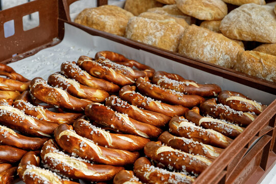 Baked goods for sale at market stall, salty pretzel or bagel