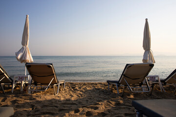 Beach with sun beds and umbrellas near the sea