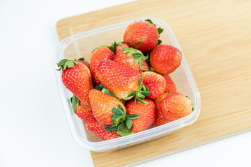 Fresh strawberries in the transparent box