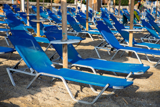 Beach with sun beds and umbrellas near the sea