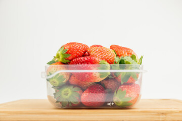 Fresh strawberries in the transparent box