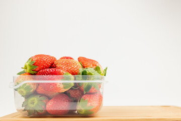 Fresh strawberries in the transparent box