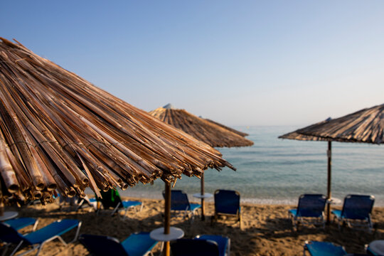 Beach with sun beds and umbrellas near the sea
