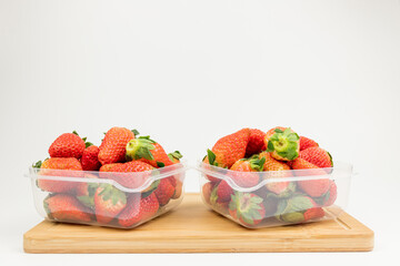 Fresh strawberries in the transparent box