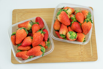 Fresh strawberries in the transparent box