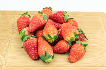 Fresh strawberries on the cutting board