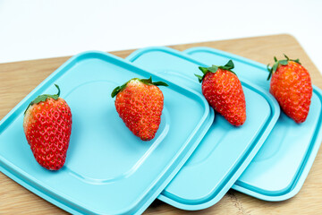 Fresh strawberries on the lid of the lunch box
