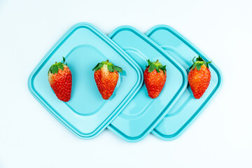 Fresh strawberries on the lid of the lunch box