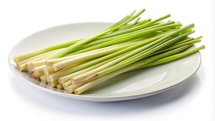 Fresh lemongrass stalks presented on a white plate, ready for cooking