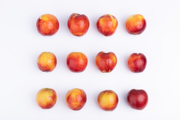 Neatly arranged fresh red plums
