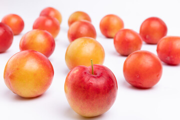 Neatly arranged fresh red plums