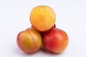 Fresh red plums cut in half