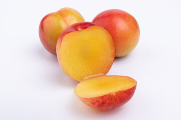 Fresh red plums cut in half
