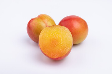 Fresh red plums cut in half