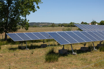 Rows of solar panels harness the sun’s power in the rural Portuguese countryside, highlighting...