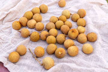 The fresh fruit longan in the dark plate