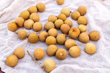 The fresh fruit longan in the dark plate