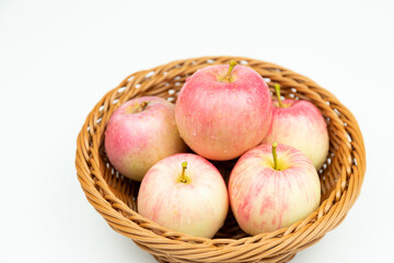 Fresh apples in the fruit plate on the wood-grain table